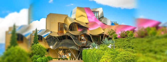 Trip Moldawien Reisetipps - Marqués de Riscal Design Hotel, Bilbao, Elciego, Spanien. Fantastisch galaktisch, unverkennbar ein Werk von Frank O. Gehry. Inmitten idyllischer Weinberge in der Rioja Region des Baskenlandes, bezaubert das schimmernde Bauobjekt mit einer Struktur bunter, edel glänzender verflochtener Metallbänder. Glanz im Baskenland - Es muss etwas ganz Besonderes sein. Emotional, zukunftsweisend, einzigartig. Denn in dieser Region, etwa 133 km südlich von Bilbao, sind Weingüter normalerweise nicht für die Öffentlichkeit zugänglich.